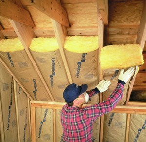 Fiberglass insulation being installed in a home.