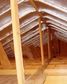 Reflective insulation installed in an unfinished attic.