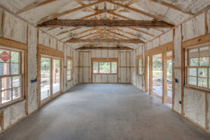 Interior structure with completed insulation in walls and ceiling.